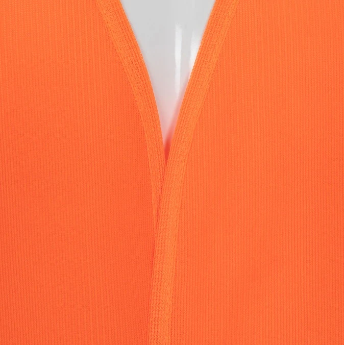 Close-up of 100 percent polyester tricot fabric and 2-inch silver reflective tape on safety vest Close-up of 100 percent polyester tricot fabric and 2-inch silver reflective tape on safety vest